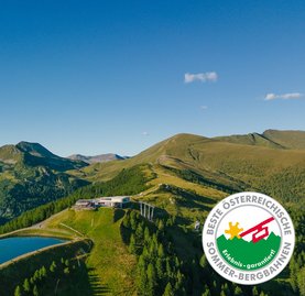 Bergstation Biosphärenparkbahn Brunnach mit Speichersee, Kärntner Nockberge, Beste Österreichische Sommer-Bergbahnen